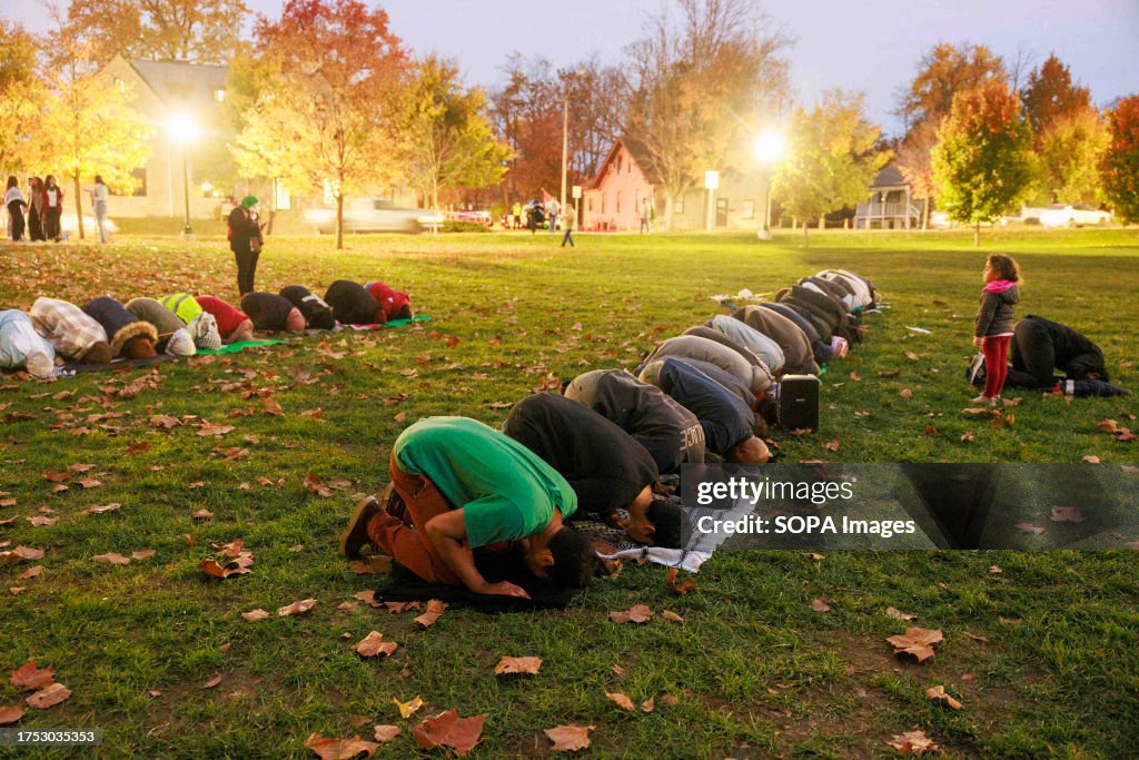 Protesters in Dunn Meadow at Indiana University pray for the...