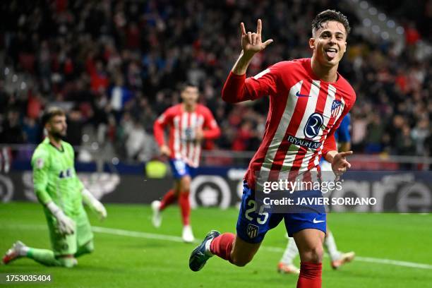 Atletico Madrid's Spanish midfielder Rodrigo Riquelme celebrates scoring the opening goal during the Spanish league football match between Club...