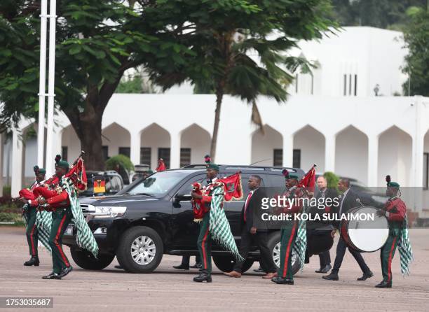 Members of the Nigerian Army brigade welcome German Chancellor for a bilateral meeting with Nigeria's President in Abuja on October 29, 2023.