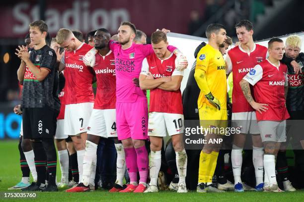 Players stand around Bas Dost of NEC Nijmegen after he collapsed during the Dutch Eredivisie match between AZ Alkmaar and NEC Nijmegen at the AFAS...