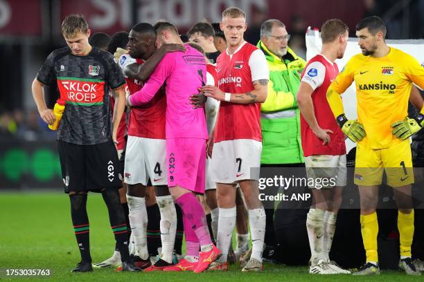 Players stand around Bas Dost of NEC Nijmegen after he collapsed during the Dutch Eredivisie match between AZ Alkmaar and NEC Nijmegen at the AFAS...