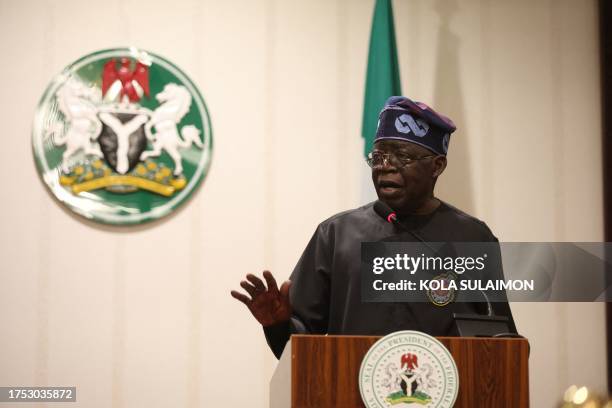 Nigeria's President Bola Ahmed Tinubu answers question from the audience after a bilateral meeting with German Chancellor in Abuja on October 29,...