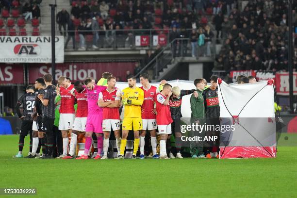 Players stand around Bas Dost of NEC Nijmegen after he collapsed during the Dutch Eredivisie match between AZ Alkmaar and NEC Nijmegen at the AFAS...