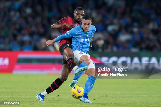 Pierre Kalulu of AC Milan and Giacomo Raspadori of SSC Napoli compete for the ball during the Serie A Tim match between SSC Napoli and AC Milan at...
