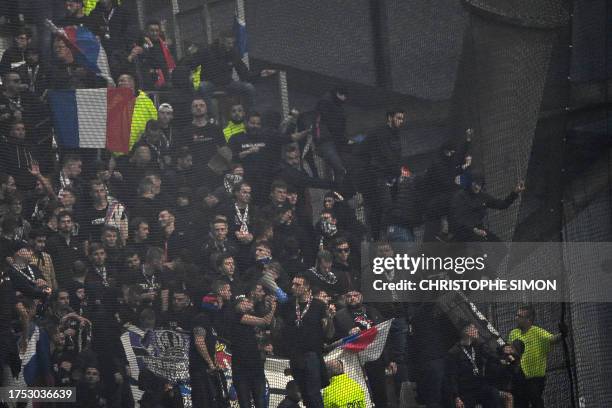 Lyon's supporters react at the Stade Velodrome in Marseille, southern France on October 29 after the French Ligue 1 football match between Marseille...