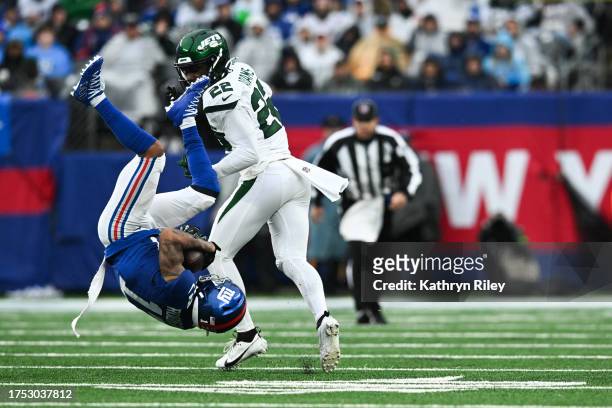 Wan'Dale Robinson of the New York Giants maintains possession of the football during the second half of the game against the New York Jets at MetLife...