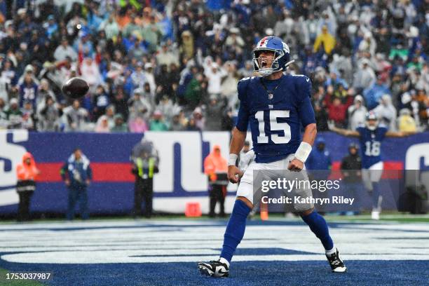 Tommy DeVito of the New York Giants celebrates after scoring a touchdown during the second half of the game against the New York Jets at MetLife...