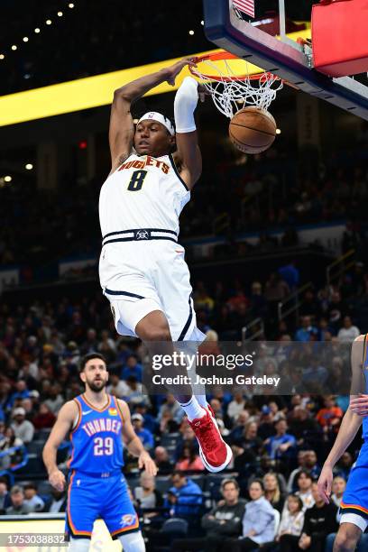 Peyton Watson of the Denver Nuggets finishes a slam dunk during the fourth quarter against the Oklahoma City Thunder at Paycom Center on October 29,...