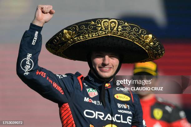 Red Bull Racing's Dutch driver Max Verstappen celebrates on the podium after winning the Formula One Mexico Grand Prix at the Hermanos Rodriguez...