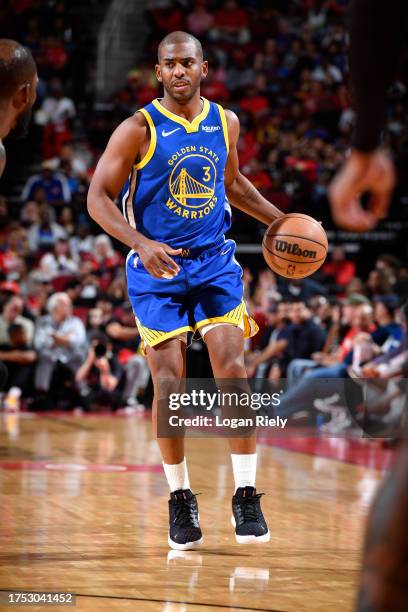 Chris Paul of the Golden State Warriors dribbles the ball during the game against the Houston Rockets on October 29, 2023 at the Toyota Center in...