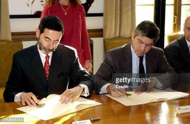 This photo from the OAA, Organization of American States, showS the vicechancellor of Brazil, Osmar Chohfi, signing agreements next to the Secretary...