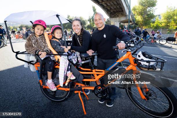 Los Angeles, CA Manny Wong and wife Rachael Wong and kids Joey and Frankie of Glendale, take a break in the middle of the 110 Freeway as they joined...