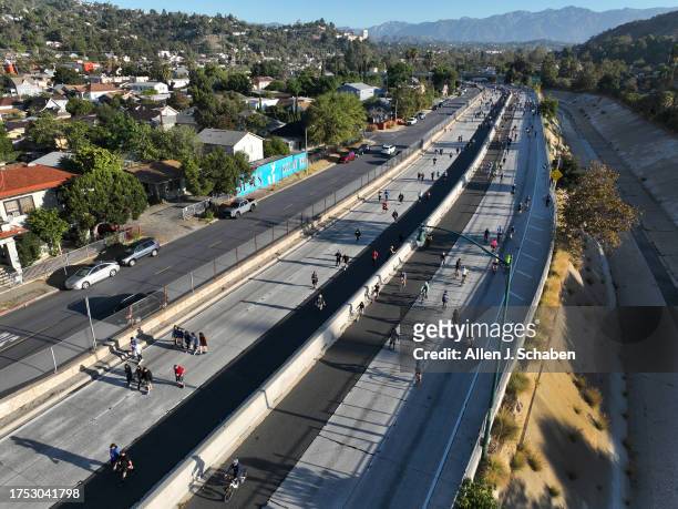 Los Angeles, CA An aerial early morning view of bicyclists, rollerbladers, skateboarders, walkers and runners taking part in ArroyoFest, where the...