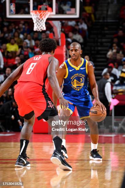 Chris Paul of the Golden State Warriors dribbles the ball during the game against the Houston Rockets on October 29, 2023 at the Toyota Center in...