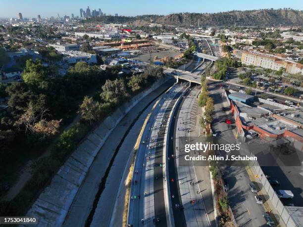 Los Angeles, CA An aerial early morning view of downtown Los Angeles and bicyclists, rollerbladers, skateboarders, walkers and runners taking part in...