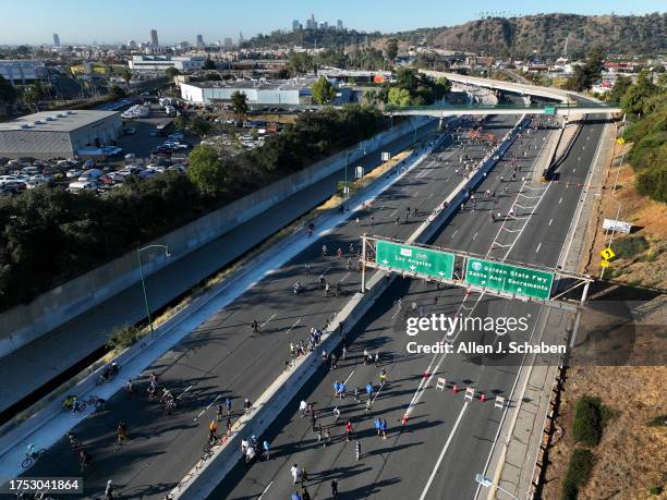 Los Angeles, CA An aerial early morning view of bicyclists, rollerbladers, skateboarders, walkers and runners taking part in ArroyoFest, where the...