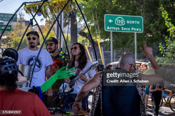 Los Angeles, CA People dance as Poco Pocho, a 4 piece cumbia band from Los Angeles, performs on El BiciCrófono Bikerophone in English a...