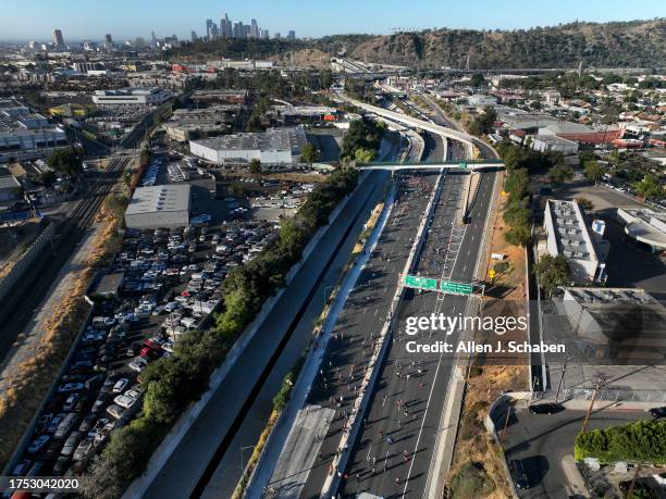 Los Angeles, CA An aerial early morning view of bicyclists, rollerbladers, skateboarders, walkers and runners taking part in ArroyoFest, where the...