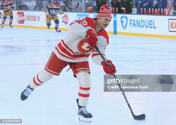 Dillon Dube of the Calgary Flames warms up prior to the game against the Edmonton Oilers for the 2023 Tim Hortons NHL Heritage Classic between the...