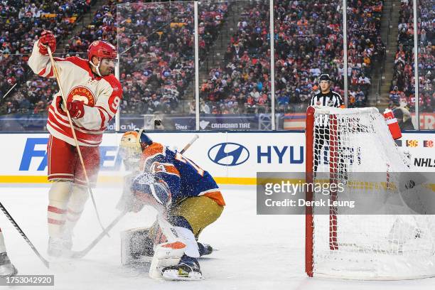 Nazem Kadri of the Calgary Flames scores against Stuart Skinner of the Edmonton Oilers during the first period of the 2023 Tim Hortons NHL Heritage...