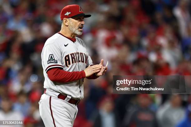 Arizona Diamondbacks manager Torey Lovullo walks to the mound in the seventh inning against the Philadelphia Phillies during Game Six of the...
