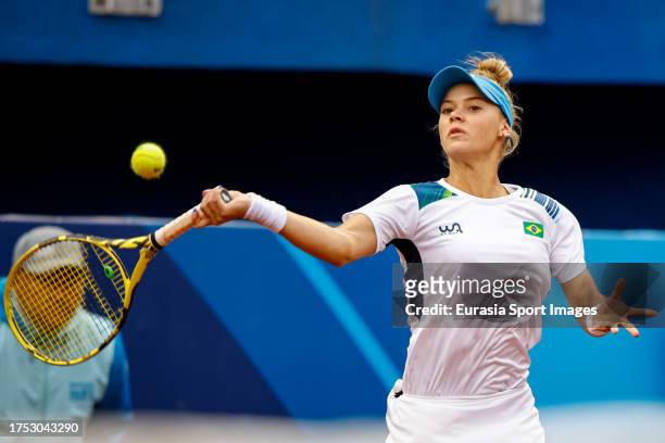 Laura Pigossi with reaches for forehand shot on her way to winning gold medal in women's tennis during the Pan American Games Santiago 2023 which...