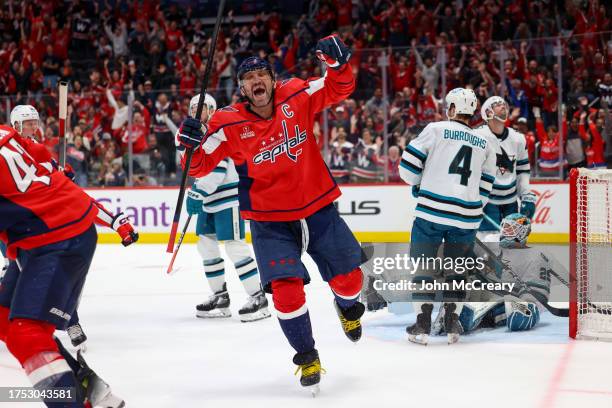 Alex Ovechkin of the Washington Capitals celebrates after assisting on a goal by Tom Wilson against the San Jose Sharks at Capital One Arena on...