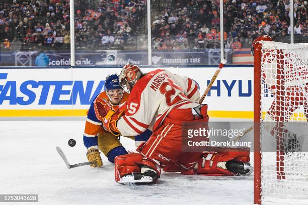 Jacob Markstrom of the Calgary Flames stops a shot from Dylan Holloway of the Edmonton Oilers during the second period of the 2023 Tim Hortons NHL...