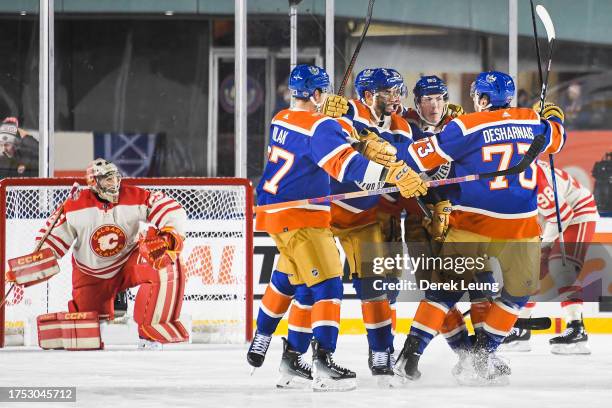 Vincent Desharnais of the Edmonton Oilers celebrates scoring against goaltender Jacob Markstrom of the Calgary Flames during the third period of the...