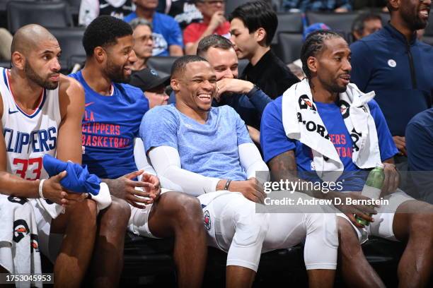Paul George, Russell Westbrook, and Kawhi Leonard of the LA Clippers smile during the game against the San Antonio Spurs on October 29, 2023 at...