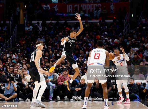 Victor Wembanyama of the San Antonio Spurs defends against Russell Westbrook of the Los Angeles Clippers during the second half of the game at...