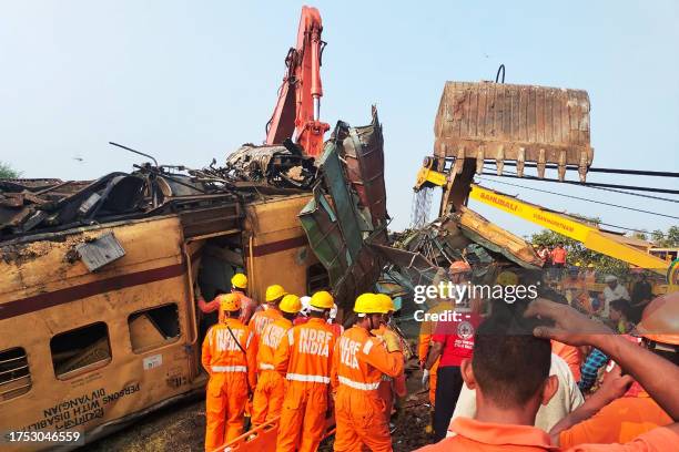 Members of the National Disaster Response Force conduct rescue operation at the site of train crash in Vizianagaram district of India's Andhra...