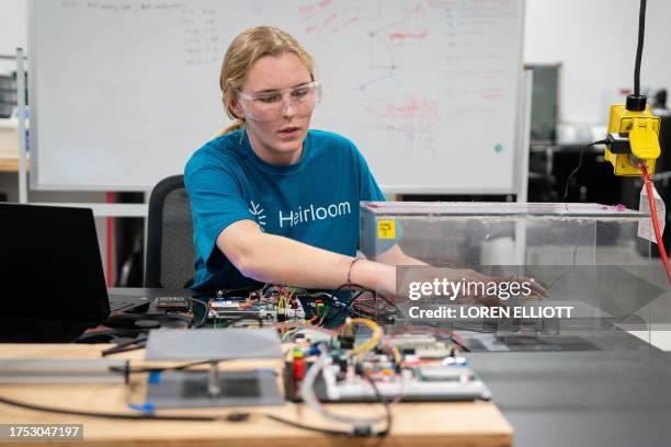 Research scientist Emily Hagood troubleshoots instrumentation for measuring carbon dioxide removal from the atmosphere inside the laboratory at...