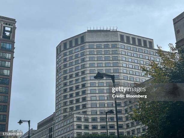 Scaffolding above a blank space where the sign has been removed from the facade of Credit Suisse's headquarters at One Cabot Square in Canary Wharf...