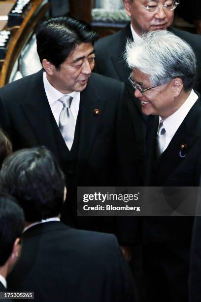 Shinzo Abe, Japan's prime minister, back left, leaves the opening session at the upper house of parliament in Tokyo, Japan, on Friday, Aug. 2, 2013....