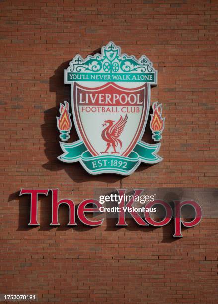 General view of the Liverpool Football Club badge on the outside of The Kop stand at Anfield ahead of the Premier League match between Liverpool FC...