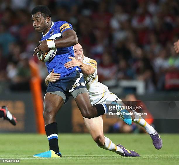 Tuvita Tamatawale of Bath is tackled by Paul Hodgson of Worcester during the J.P. Morgan Asset Management Premiership Rugby 7's held at Kingsholm...
