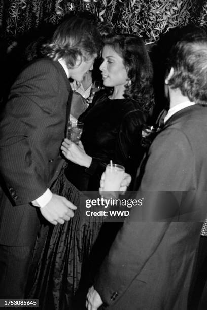 Christopher Atkins and Bianca Jagger attend a party, celebrating the 16th birthday of Calvin Klein's daughter, at Studio 54 in New York City on...