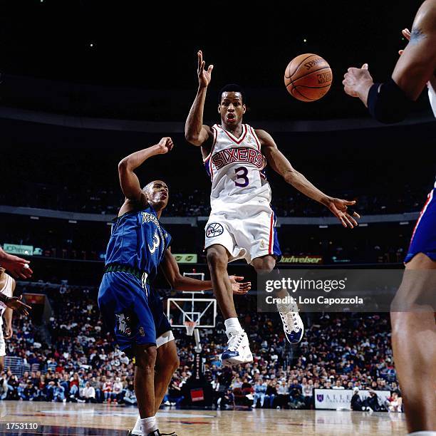 Allen Iverson of the Philadelphia 76ers makes a driving no-look pass against the Minnesota Timberwolves at the First Union Center during the 1998...