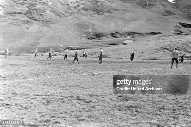 Crews of the whaöing boats and the factory vessel "Jan Wellem" during a football match while a shore leave at South Georgia, 1930s.