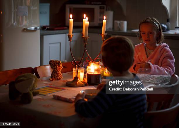 breakfast by candle light - blackout picture stock-fotos und bilder