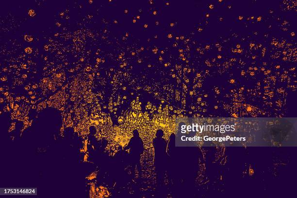 celebrating halloween with large group of glowing jack o' lanterns - floating lanterns stock illustrations