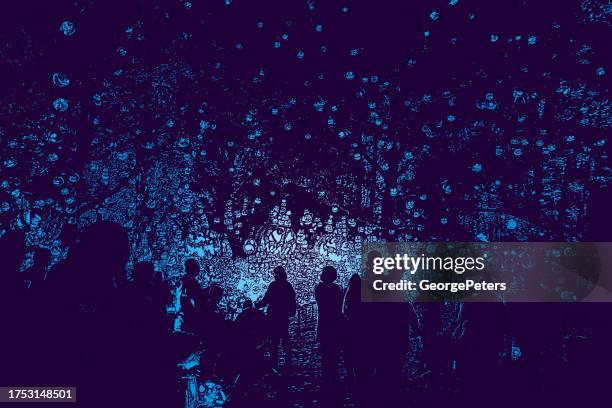celebrating halloween with large group of glowing jack o' lanterns - floating lantern stock illustrations