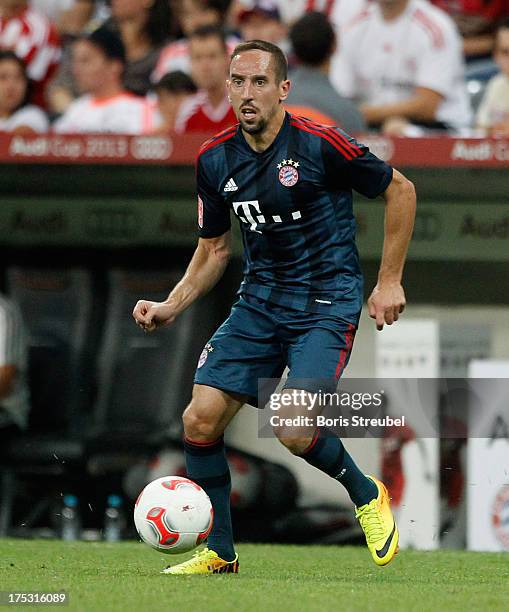 Franck Ribery of Muenchen runs with the ball during the Audi Cup 2013 semifinal match between FC Bayern Muenchen and FC Sao Paulo at Allianz Arena on...