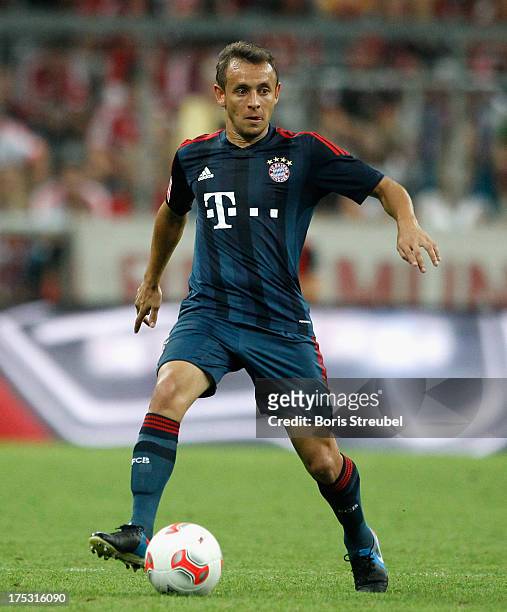 Rafinha of Muenchen runs with the ball during the Audi Cup 2013 semifinal match between FC Bayern Muenchen and FC Sao Paulo at Allianz Arena on July...