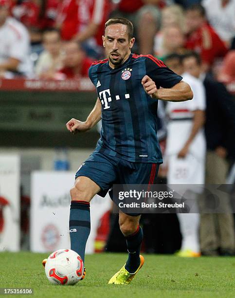 Franck Ribery of Muenchen runs with the ball during the Audi Cup 2013 semifinal match between FC Bayern Muenchen and FC Sao Paulo at Allianz Arena on...