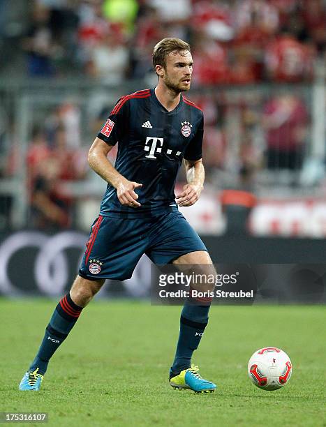 Jan Kirchhoff of Muenchen runs with the ball during the Audi Cup 2013 semifinal match between FC Bayern Muenchen and FC Sao Paulo at Allianz Arena on...