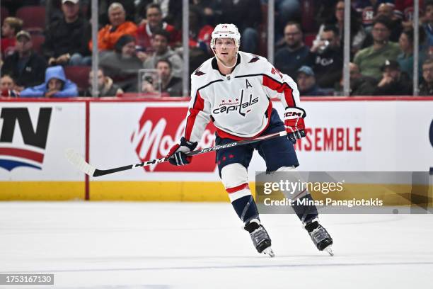 John Carlson of the Washington Capitals skates during the third period against the Montreal Canadiens at the Bell Centre on October 21, 2023 in...