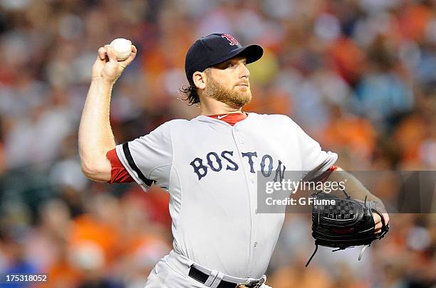 Ryan Dempster of the Boston Red Sox pitches in the first inning against the Baltimore Orioles at Oriole Park at Camden Yards on July 27, 2013 in...