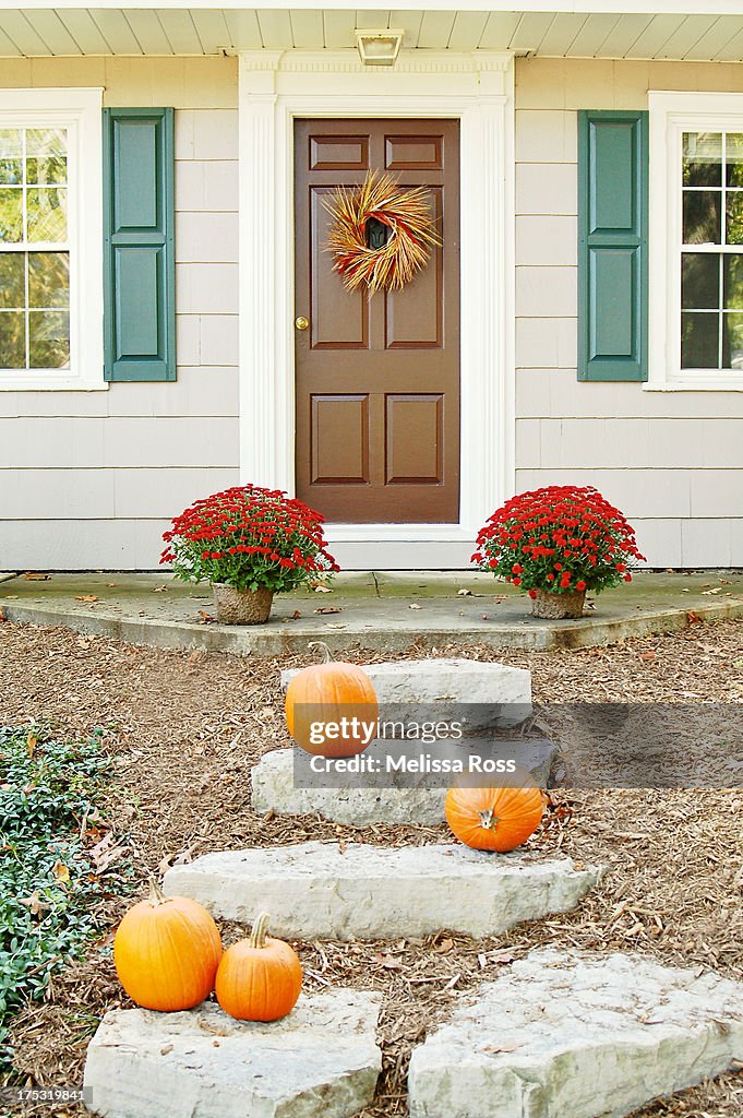 Doorstep of a residential home decorated for Fall.